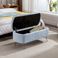 Banc de rangement ottoman rembourré avec pieds épingle dorés